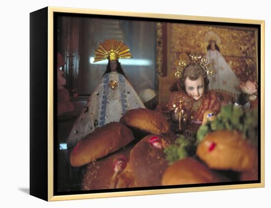 Altar of Food, Candles, Baby Jesus Statues and the Virgins of Soledad and Guadalupe, Oaxaca, Mexico-Judith Haden-Framed Premier Image Canvas