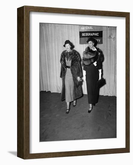Amelia Earhart arrives with Eleanor Roosevelt to address the National Geographic Society, 1935-Harris & Ewing-Framed Photographic Print