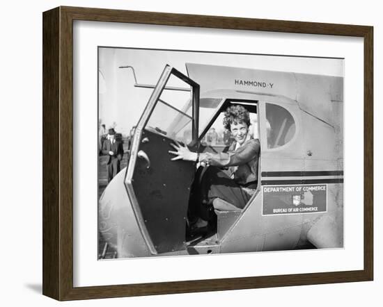 Amelia Earhart in an aeroplane, 1936-Harris & Ewing-Framed Photographic Print