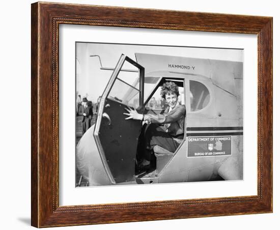 Amelia Earhart in an aeroplane, 1936-Harris & Ewing-Framed Photographic Print