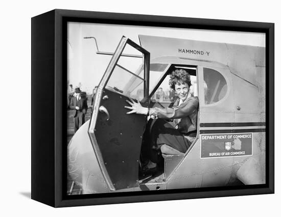 Amelia Earhart in an aeroplane, 1936-Harris & Ewing-Framed Premier Image Canvas