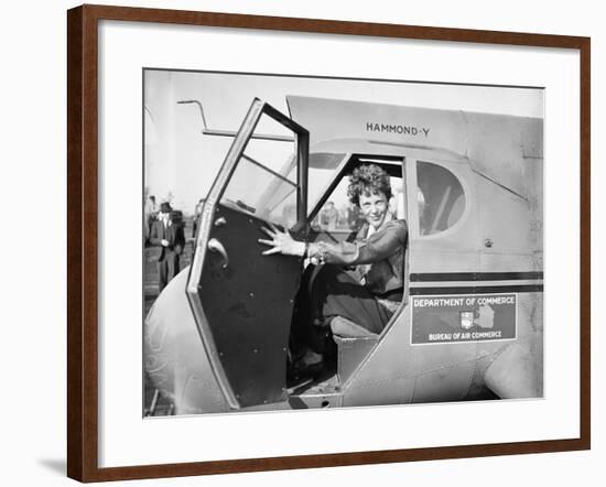 Amelia Earhart in an aeroplane, 1936-Harris & Ewing-Framed Photographic Print