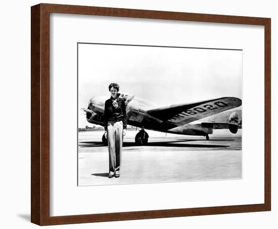 Amelia Earhart Standing in Front of the Lockheed Electra in Which She Disappeared in July 29, 1937-null-Framed Photo