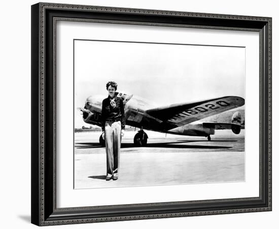 Amelia Earhart Standing in Front of the Lockheed Electra in Which She Disappeared in July 29, 1937-null-Framed Photo