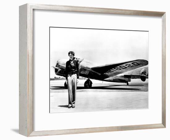 Amelia Earhart Standing in Front of the Lockheed Electra in Which She Disappeared in July 29, 1937-null-Framed Photo