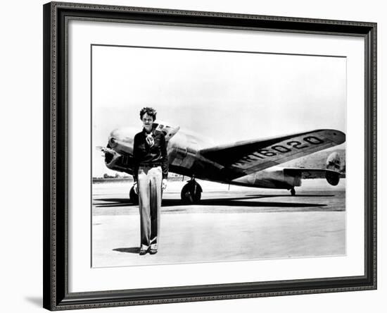 Amelia Earhart Standing in Front of the Lockheed Electra in Which She Disappeared in July 29, 1937-null-Framed Photo