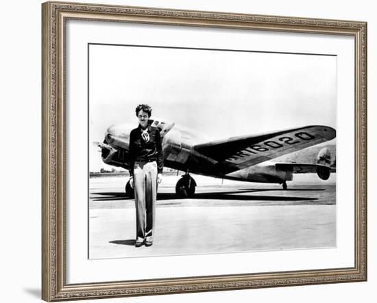 Amelia Earhart Standing in Front of the Lockheed Electra in Which She Disappeared in July 29, 1937-null-Framed Photo