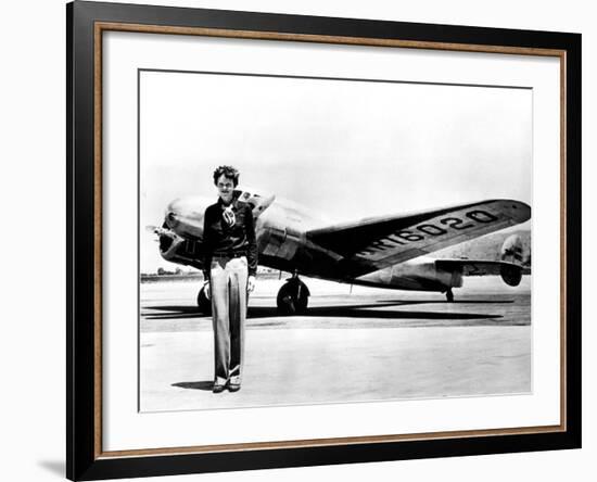 Amelia Earhart Standing in Front of the Lockheed Electra in Which She Disappeared in July 29, 1937-null-Framed Photo