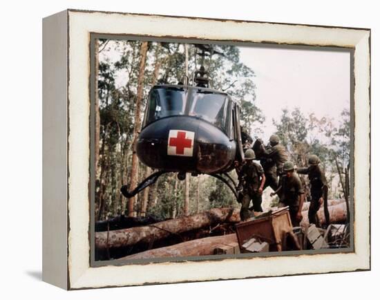 American 4th Battalion, 173rd Airborne Brigade Soldiers Loading Wounded Onto a "Huey" Helicopter-Alfred Batungbacal-Framed Premier Image Canvas