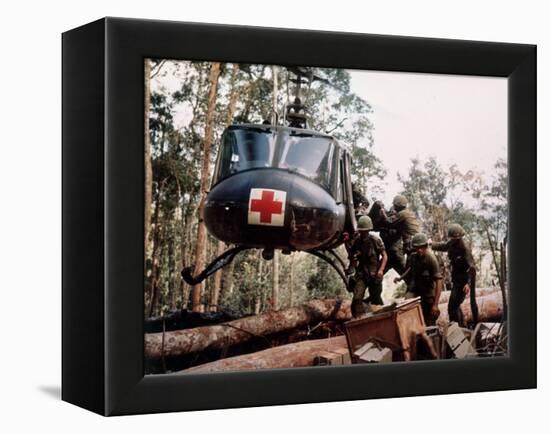 American 4th Battalion, 173rd Airborne Brigade Soldiers Loading Wounded Onto a "Huey" Helicopter-Alfred Batungbacal-Framed Premier Image Canvas