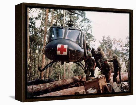 American 4th Battalion, 173rd Airborne Brigade Soldiers Loading Wounded Onto a "Huey" Helicopter-Alfred Batungbacal-Framed Premier Image Canvas