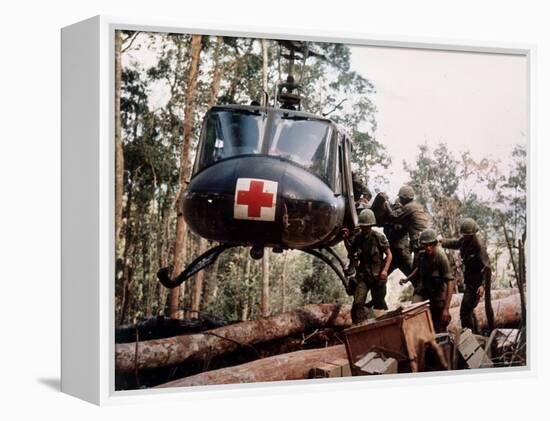 American 4th Battalion, 173rd Airborne Brigade Soldiers Loading Wounded Onto a "Huey" Helicopter-Alfred Batungbacal-Framed Premier Image Canvas