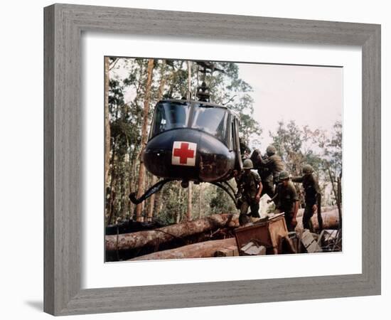 American 4th Battalion, 173rd Airborne Brigade Soldiers Loading Wounded Onto a "Huey" Helicopter-Alfred Batungbacal-Framed Photographic Print