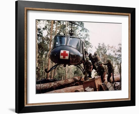 American 4th Battalion, 173rd Airborne Brigade Soldiers Loading Wounded Onto a "Huey" Helicopter-Alfred Batungbacal-Framed Photographic Print