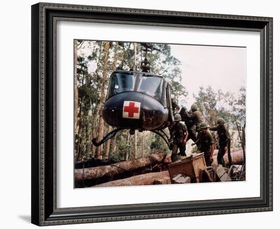 American 4th Battalion, 173rd Airborne Brigade Soldiers Loading Wounded Onto a "Huey" Helicopter-Alfred Batungbacal-Framed Photographic Print