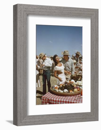 American Actor Rock Hudson Holds Actress Elizabeth Taylor While Filming 'Giant', Marfa, Texas, 1956-Allan Grant-Framed Photographic Print