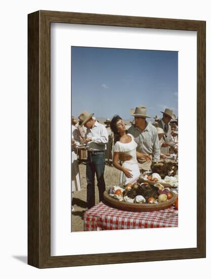 American Actor Rock Hudson Holds Actress Elizabeth Taylor While Filming 'Giant', Marfa, Texas, 1956-Allan Grant-Framed Photographic Print