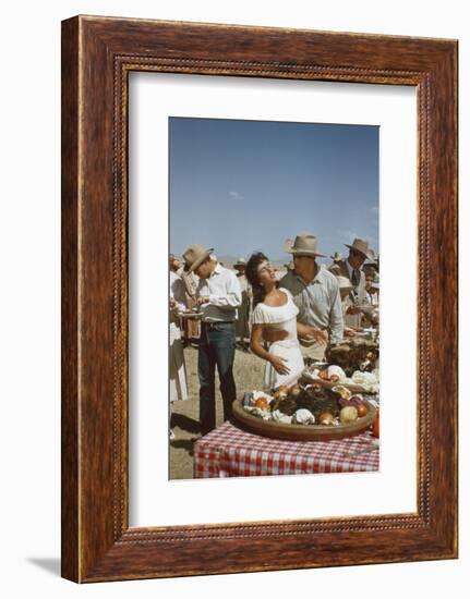 American Actor Rock Hudson Holds Actress Elizabeth Taylor While Filming 'Giant', Marfa, Texas, 1956-Allan Grant-Framed Photographic Print