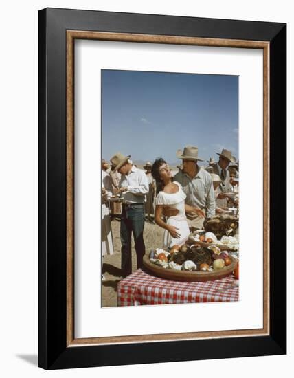 American Actor Rock Hudson Holds Actress Elizabeth Taylor While Filming 'Giant', Marfa, Texas, 1956-Allan Grant-Framed Photographic Print