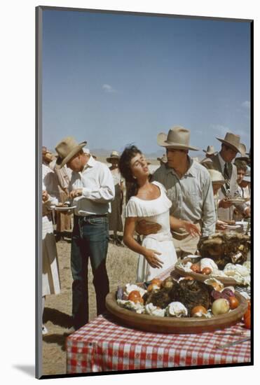 American Actor Rock Hudson Holds Actress Elizabeth Taylor While Filming 'Giant', Marfa, Texas, 1956-Allan Grant-Mounted Photographic Print