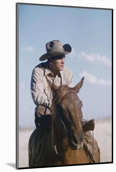 American Actor Rock Hudson on a Horse During the Filming of 'Giant', Near Marfa, Texas, 1955-Allan Grant-Mounted Photographic Print