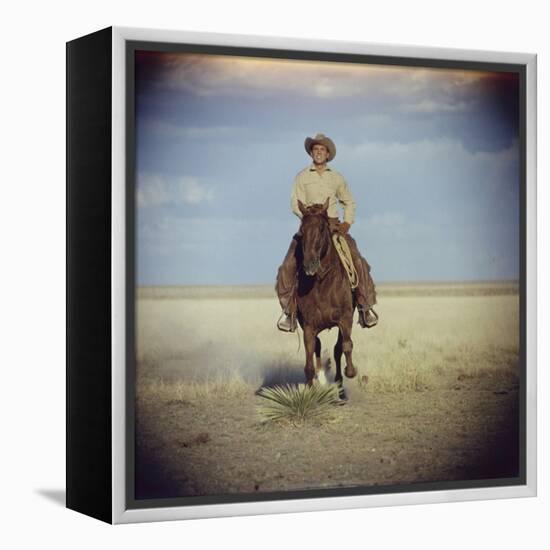 American Actor Rock Hudson Riding a Horse During Filming of 'Giant', Near Marfa, Texas, 1955-Allan Grant-Framed Premier Image Canvas