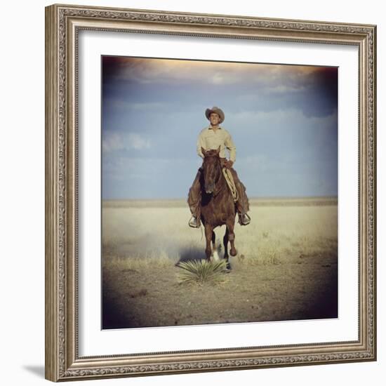 American Actor Rock Hudson Riding a Horse During Filming of 'Giant', Near Marfa, Texas, 1955-Allan Grant-Framed Photographic Print