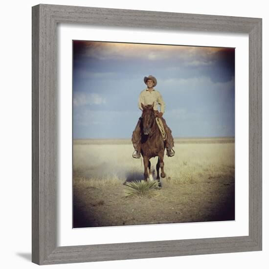 American Actor Rock Hudson Riding a Horse During Filming of 'Giant', Near Marfa, Texas, 1955-Allan Grant-Framed Photographic Print