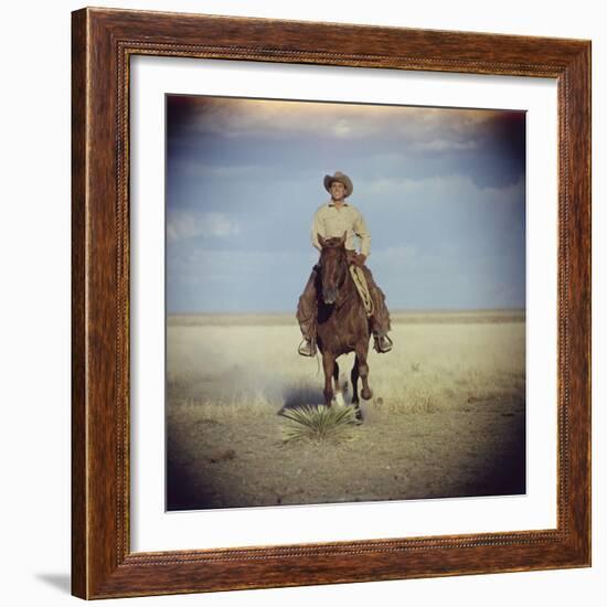 American Actor Rock Hudson Riding a Horse During Filming of 'Giant', Near Marfa, Texas, 1955-Allan Grant-Framed Photographic Print