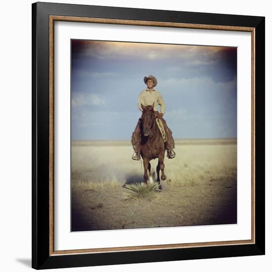 American Actor Rock Hudson Riding a Horse During Filming of 'Giant', Near Marfa, Texas, 1955-Allan Grant-Framed Photographic Print