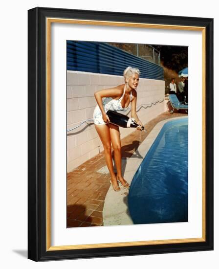 American Actress Jayne Mansfield with a Bottle of Champagne, Near a Swimming Pool, 1956-1957-null-Framed Photo