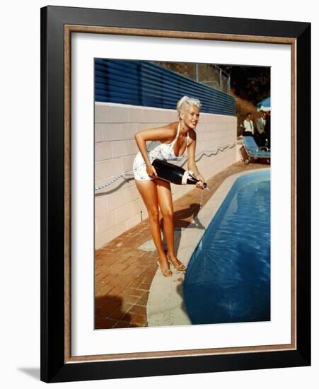 American Actress Jayne Mansfield with a Bottle of Champagne, Near a Swimming Pool, 1956-1957-null-Framed Photo