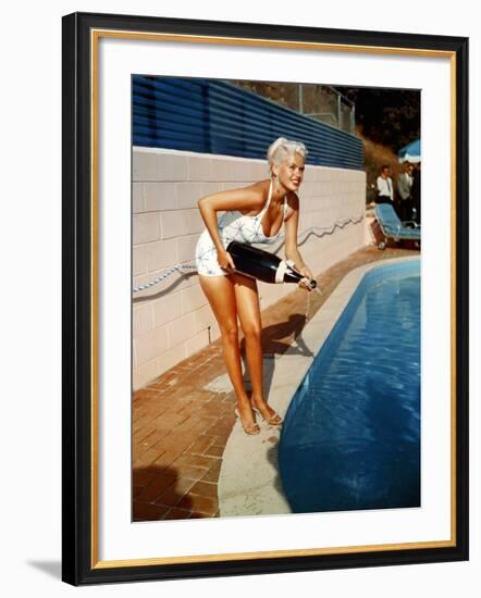 American Actress Jayne Mansfield with a Bottle of Champagne, Near a Swimming Pool, 1956-1957-null-Framed Photo