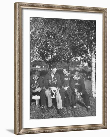 American and Russian Olympic Athletes Sitting on Bench and Talking-Ralph Crane-Framed Premium Photographic Print