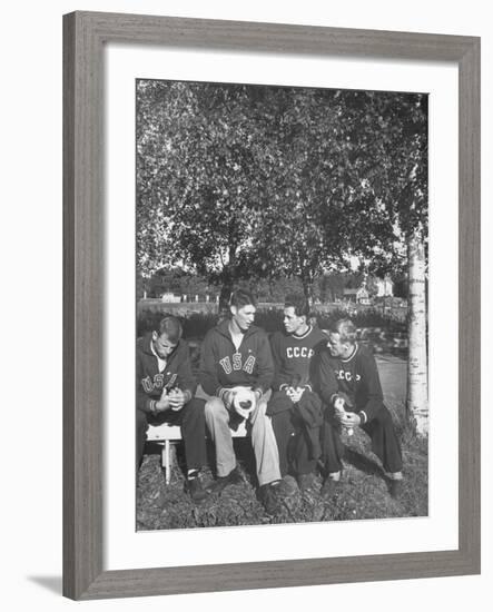 American and Russian Olympic Athletes Sitting on Bench and Talking-Ralph Crane-Framed Premium Photographic Print