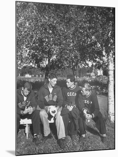 American and Russian Olympic Athletes Sitting on Bench and Talking-Ralph Crane-Mounted Premium Photographic Print