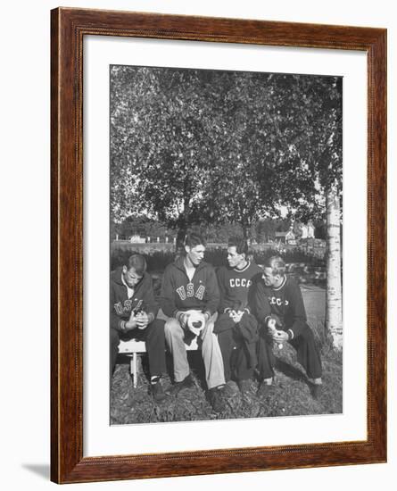 American and Russian Olympic Athletes Sitting on Bench and Talking-Ralph Crane-Framed Premium Photographic Print