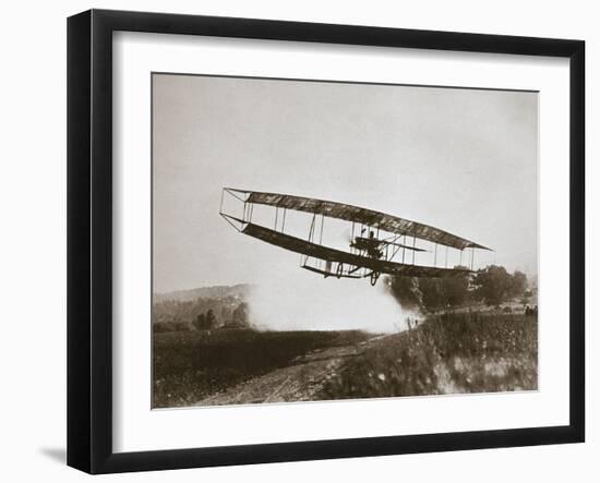 American aviator Glenn Curtiss making the first heavier-than-air flight in his 'June Bug', 1908-Edwin Levick-Framed Photographic Print