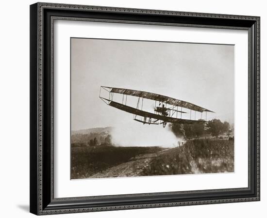 American aviator Glenn Curtiss making the first heavier-than-air flight in his 'June Bug', 1908-Edwin Levick-Framed Photographic Print