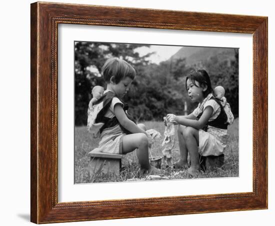 American Child Playing with Chinese Friend, Washing Doll Clothes-John Dominis-Framed Photographic Print