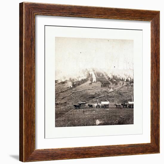 American Civil War: Three Horse-Drawn Covered Wagons in the Foreground. Soldiers Marching in Format-null-Framed Giclee Print