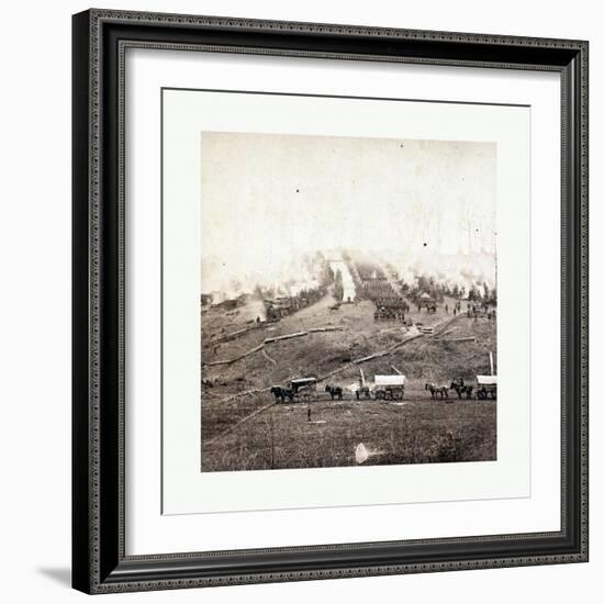 American Civil War: Three Horse-Drawn Covered Wagons in the Foreground. Soldiers Marching in Format-null-Framed Giclee Print