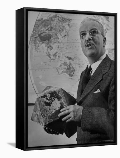 American Engineer and Architect Buckminster Fuller Holding a Globe-Andreas Feininger-Framed Premier Image Canvas