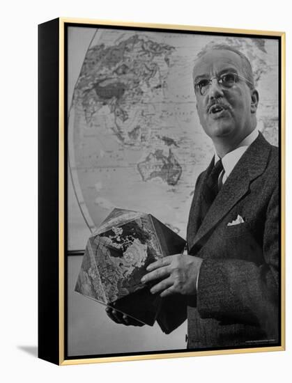 American Engineer and Architect Buckminster Fuller Holding a Globe-Andreas Feininger-Framed Premier Image Canvas