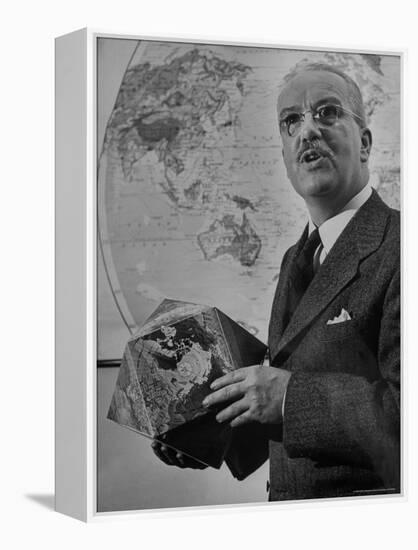 American Engineer and Architect Buckminster Fuller Holding a Globe-Andreas Feininger-Framed Premier Image Canvas