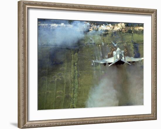 American F4C Phantom Jet Firing Rockets into Viet Cong Stronghold village During the Vietnam War-Larry Burrows-Framed Photographic Print