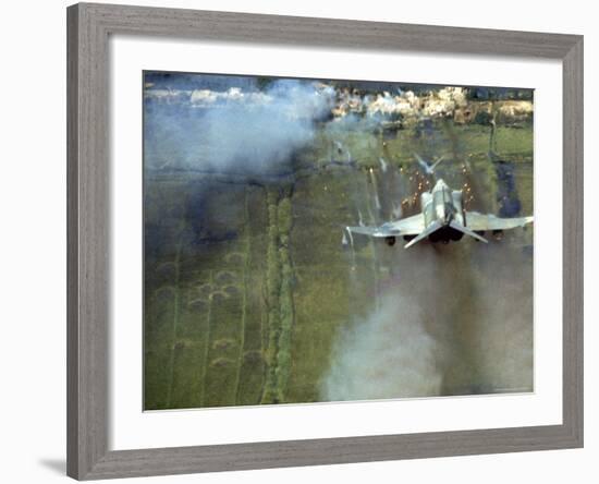American F4C Phantom Jet Firing Rockets into Viet Cong Stronghold village During the Vietnam War-Larry Burrows-Framed Photographic Print