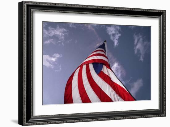 American Flag Against Blue-null-Framed Photo