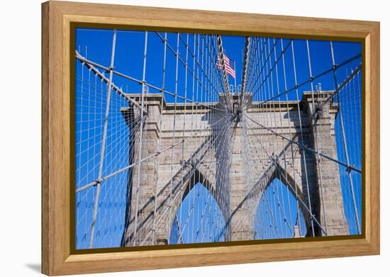 American flag flying over Brooklyn Bridge, New York City, New York-null-Framed Premier Image Canvas