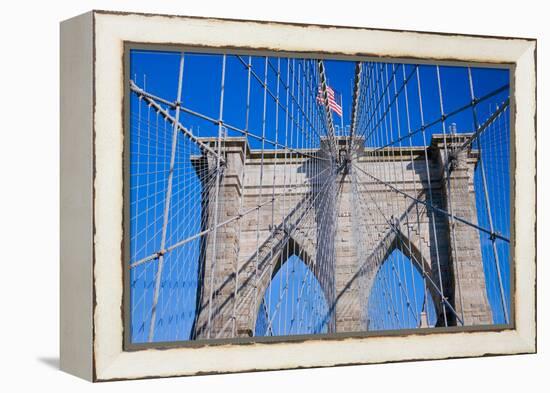 American flag flying over Brooklyn Bridge, New York City, New York-null-Framed Premier Image Canvas